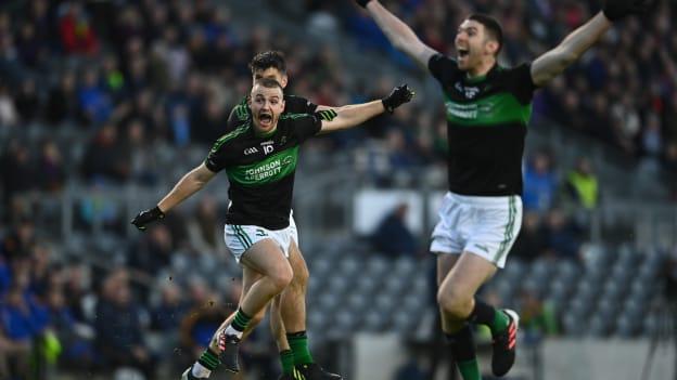 Conor Horgan of Nemo Rangers, left, celebrates after scoring his side's first goal during the Cork County Senior Club Football Championship Final match between Nemo Rangers and St Finbarr's at Páirc Ui Chaoimh in Cork. 