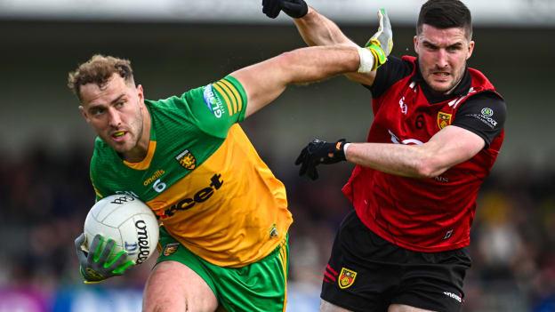 Stephen McMenamin, Donegal, and Niall McParland, Down, in Ulster SFC action at Páirc Esler. Photo by Ramsey Cardy/Sportsfile