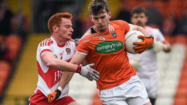 Ethan Raferty and Conor McAtamney clash at the Athletic Grounds.