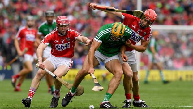 Dan Morrissey, Limerick, and Daniel Kearney and Bill Cooper, Cork, tussle at Croke Park.