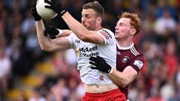 Brian Kennedy, Tyrone, and Ronan Wallace, Westmeath, in All-Ireland SFC action. Photo by Ramsey Cardy/Sportsfile