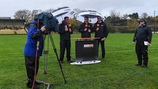TG4 presenter Micheál Ó Domhnaill, left, alongside analysts Mícheál Ó Cróinín and Aodán Mac Gearailt, as floor manager Odhrán Mac Murchadha looks on, as they broadcast before the 2018 AIB Munster GAA Football Senior Club Championship semi-final match between Dr Crokes and St Finbarr's at Dr Crokes GAA, in Killarney, Co. Kerry. 