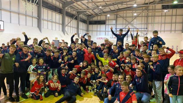 Trim players celebrate after winning senior, minor, and U-13 Meath county titles on the same weekend. 