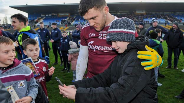 Galway's Damien Comer with young supporters following the FBD League Final at Dr Hyde Park in January.