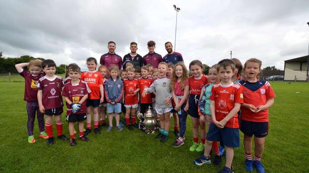 Caulry's 'Red Tigers' academy players pictured with the Tailteann Cup and the club's county team representatives. 