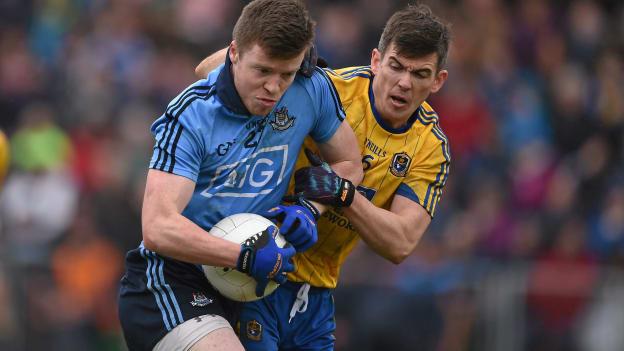 Robbie McDaid fends off Sean Purcell.