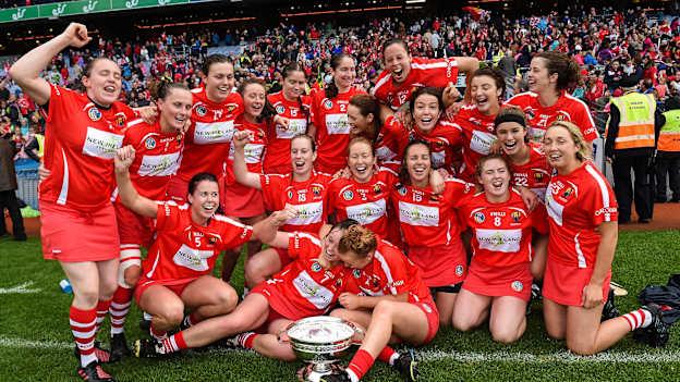 Cork players celebrating with the O Duffy Cup at Croke Park.