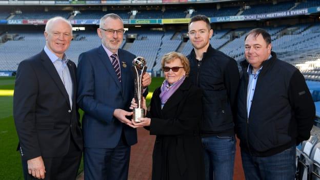 GAA President, Larry McCarthy, presents the Dermot Early family award to the Rock family, left to right, Barney Rock, Betty Rock, Dean Rock, and Joe Rock. 