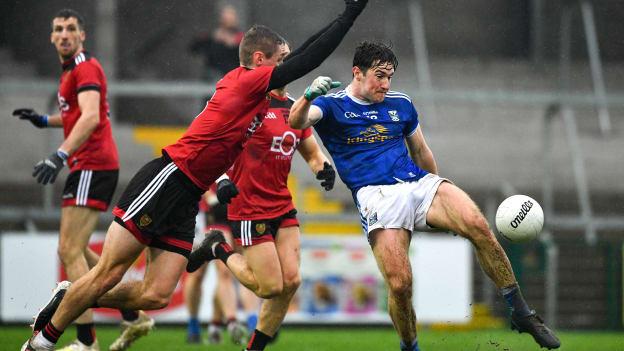 Oisín Kiernan of Cavan in action against Caolán Mooney of Down during the Ulster GAA Football Senior Championship Semi-Final match between Cavan and Down at Athletic Grounds in Armagh. 