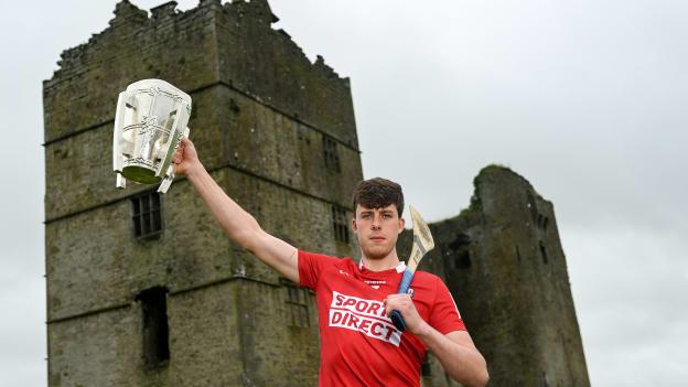 Robert Downey of Cork poses for a portrait with the Liam MacCarthy Cup at Loughmore Castle at the GAA Hurling All-Ireland Senior Championship Series national launch in Tipperary.
