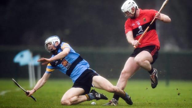 Huw Lawlor, UCD, and Michael Breen, UCC, tussle for possession at Belfield.