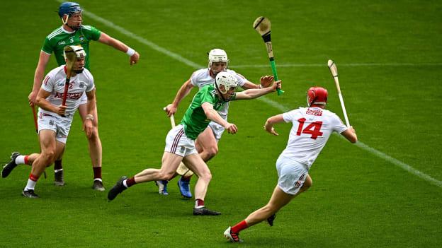 Josh Coll attempts to break through two Cork tacklers at Páirc Uí Chaoimh earlier this year. 