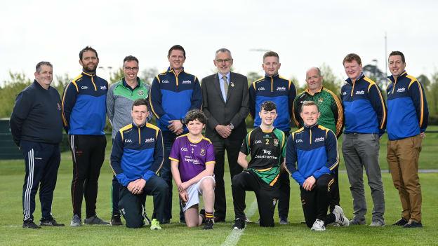 Connacht hurling director Damien Coleman (fourth from left, back row) and Ulster hurling director Kevin Kelly (second from right, back row) have seen the benefits of the Electric Ireland Celtic Challenge competition. 