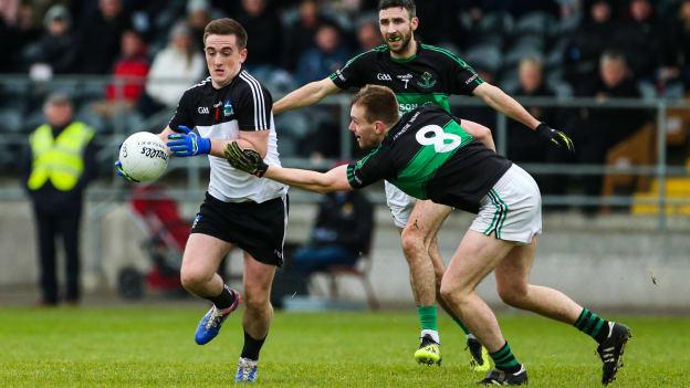 Stephen Brosnan, Newcastle West, and Alan O'Donovan, Nemo Rangers, during the AIB Munster Club SFC encounter at Mallow.