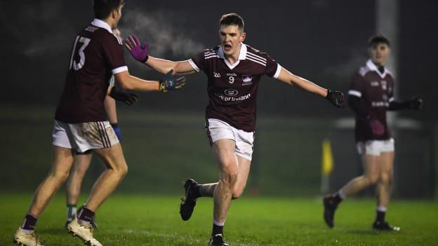 Cein Darcy of NUI Galway, centre, and team mate Rob Finnerty celebrate their side's goal during the Electric Ireland Sigerson Cup Round 2 match between Queens University Belfast and NUI Galway at The Dub in Belfast, Co Antrim.