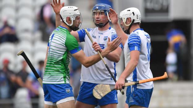 Shaun O'Brien, Conor Prunty, and Shane Bennett celebrate following Waterford's win over Tipperary.