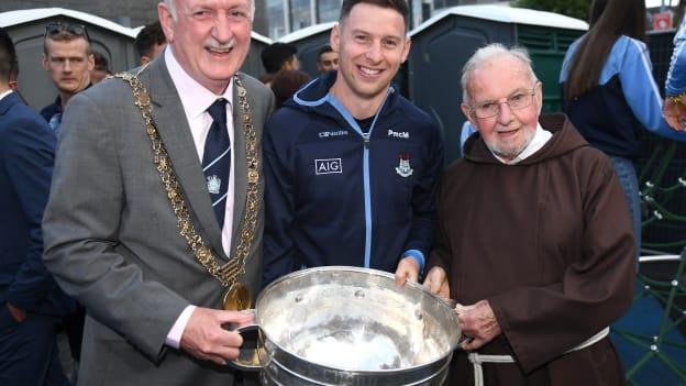 Lord Mayor of Dublin Niall Ring, left, and Brother Kevin Crowley with Dublin footballer Philip McMahon during the Dublin All-Ireland Football Winning team's homecoming at Smithfield in Dublin. 