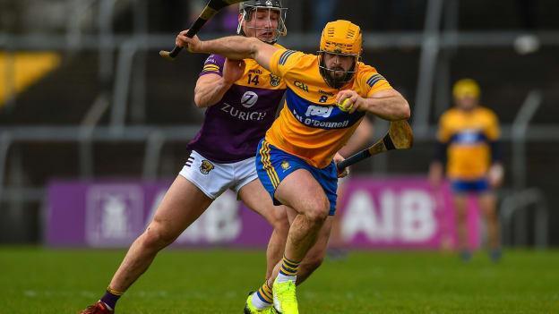 Jason McCarthy, Clare, and Mikie Dwyer, Wexford, in Allianz Hurling League action at Cusack Park.