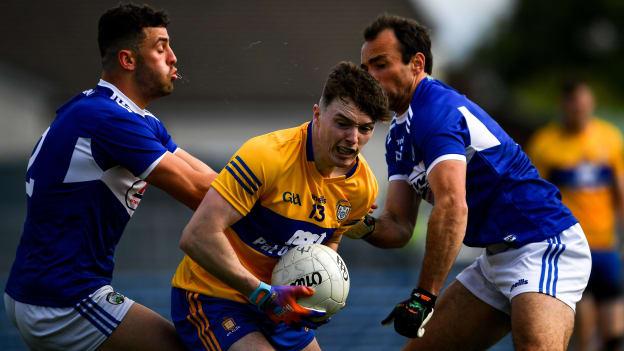 Clare's Gavin Cooney surrounded by Laois' Gareth Dillon and Robert Pigott at Cusack Park.
