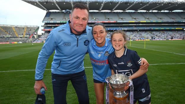 Dublin manager Mick Bohan, daughter Freya right, and Sinéad Goldrick celebrate with the Mary Ramsbottom Cup after the Leinster LGFA Senior Football Championship Final match beween Meath and Dublin at Croke Park in Dublin. 