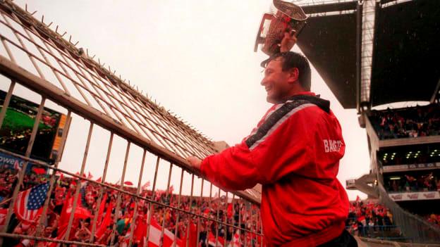 Cork manager Jimmy Barry Murphy shows off the Liam MacCarthy Cup to Cork supporters on Hill 16 following victory over Kilkenny in the 1999 All-Ireland SHC Final. 