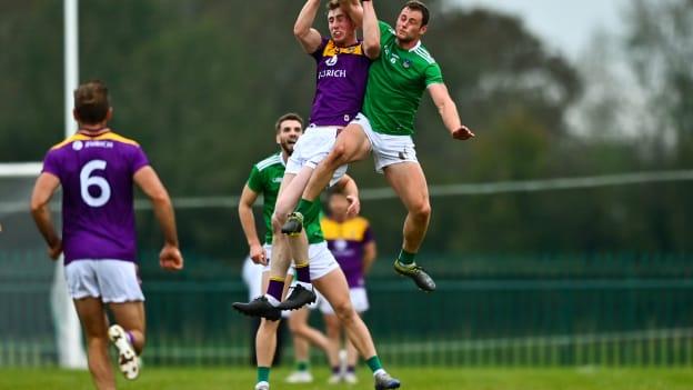 Nick Doyle, Wexford, and Darragh Treacy, Limerick, collide at Rathkeale.