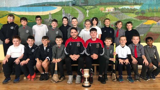 Naomh Eoin captain Thomas O'Callaghan and Evan Davey visited the pupils at Carraroe NS with the SHC cup on Tuesday.