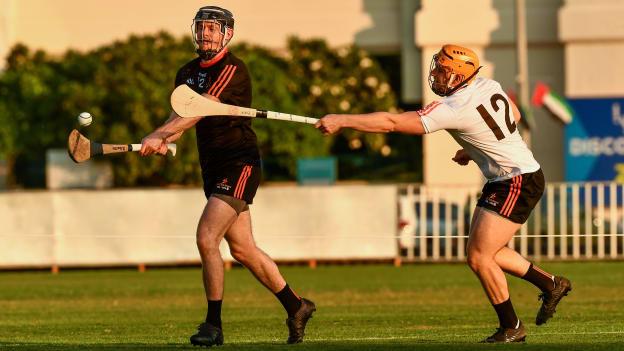 Donegal's Declan Coulter of the 2018 PwC All-Stars in action against Laois' Enda Rowland of 2019 PwC All-Stars during the PwC All Star Hurling Tour 2019 All Star game at Zayed Sport City in Abu Dhabi, United Arab Emirates.