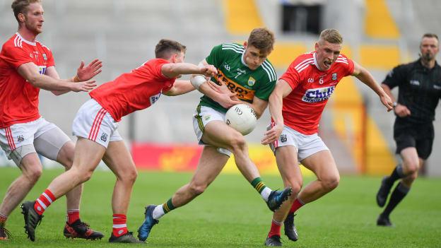 Gavin White of Kerry is tackled by Kevin O’Donovan and Sean White of Cork during the Munster GAA Football Senior Championship Final match between Cork and Kerry at Páirc Ui Chaoimh in Cork. 