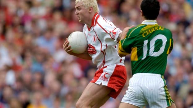 Owen Mulligan, Tyrone, and Paul Galvin, Kerry, collide during the 2005 All Ireland SFC Final.