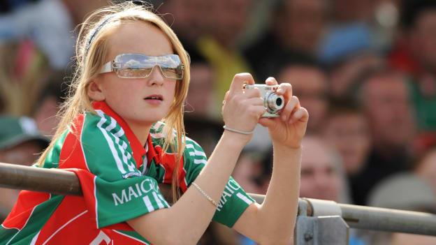 A then eleven-year-old Shauna Howley pictured taking photographs of her brother Trevor while he played for Mayo against New York in the first round of the 2009 Connacht Senior Football Championship. 