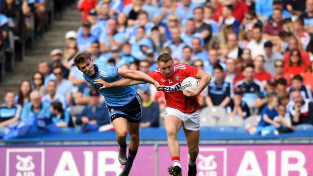 Brian Hurley of Cork is tackled by Michael Fitzsimons of Dublin during the GAA Football All-Ireland Senior Championship Quarter-Final Group 2 Phase 1 match between Dublin and Cork at Croke Park in Dublin. 