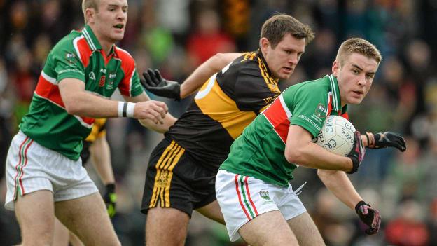 Noel McGrath and younger brother John in action in the 2014 Munster Club championship against Dr Crokes