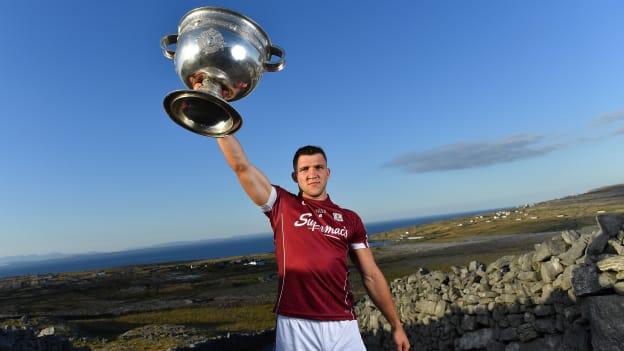 Damien Comer pictured with the Sam Maguire Cup at the launch of the All-Ireland Series of the Football Championship at Dún Aonghasa on Inis Mór. 