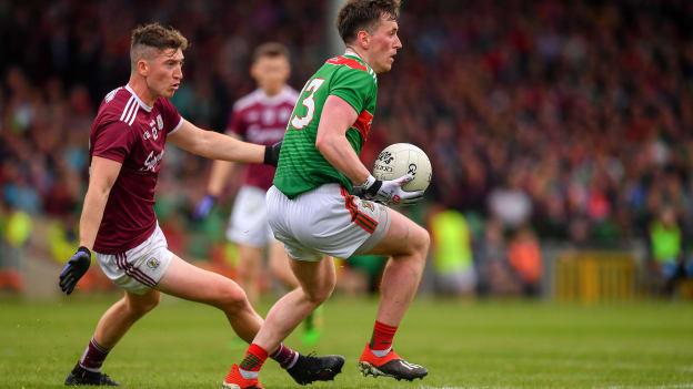 Cillian O'Connor, Mayo, and Johnny Heaney, Galway, during the 2019 All Ireland SFC Qualifier at the LIT Gaelic Grounds.