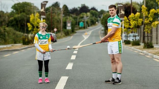 Ailis Malone pictured with Offaly senior hurler Cillian Kiely at the start of their solo run on Sunday morning.