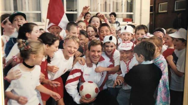 Fergal Logan is mobbed by children in St. Marys Primary School, Stewartstown, on the Friday before the 1995 All-Ireland SFC Final. 