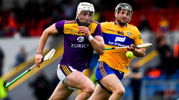 Rory O'Connor of Wexford and Jack Browne of Clare in a race for possession during the 2021 Allianz Hurling League Division 1 Group B Round 2 match between Clare and Wexford at Cusack Park in Ennis, Clare. 