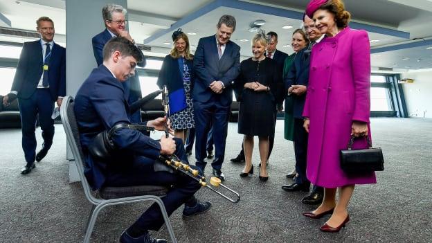 King Carl XVI Gustaf and Queen Silvia of Sweden being welcomed to Croke Park by Uilleann piper Eamonn Óg O Donnchadha.