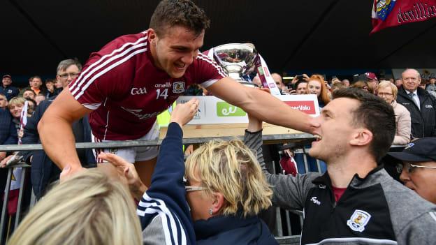 Galway captain Damien Comer is congratulated by his mother Marie, sister Nicola and brother Jonathan just before he lifts the JJ Nestor Cup after Connacht Final victory over Roscommon. 