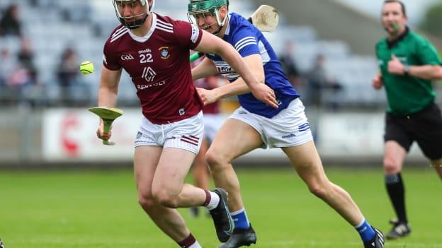Eoin Keyes, Westmeath, and Seán Downey, Laois, in Leinster Senior Hurling Championship action.