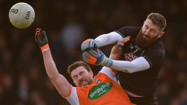 Kildare goalkeeper Mark Donnellan punches the ball away from Brendan Donaghy of Armagh during the Allianz Football League Division 2 Round 1 match between Kildare and Armagh at St Conleth's Park in Newbridge, Kildare. 