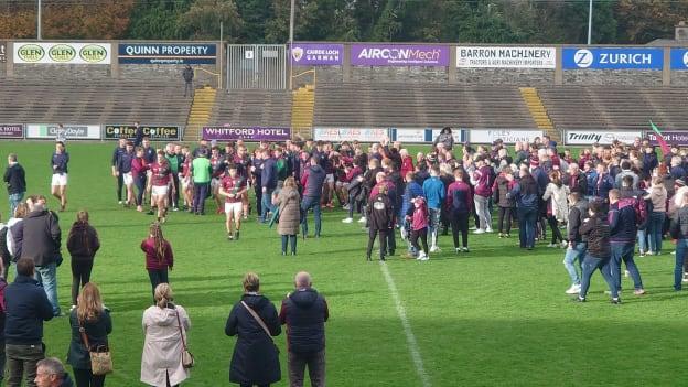 Portarlington players celebrate with their supporters after victory over Castletown. 