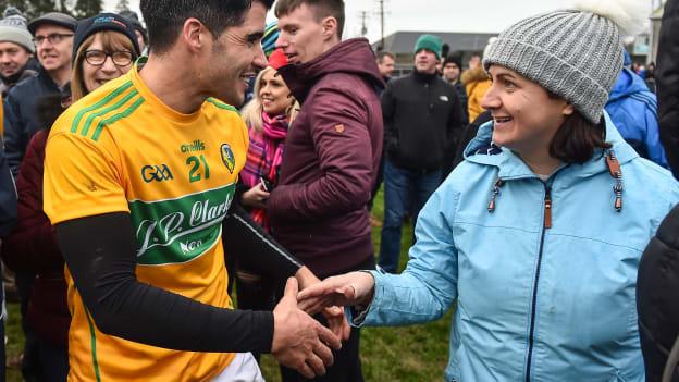 Emlyn Mulligan celebrates with a Leitrim supporter after promotion to Division 3 of the Allianz Football League was assured by victory over London. 