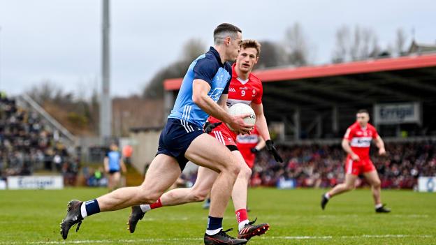 Brian Fenton, Dublin, and Brendan Rogers, Derry, in Allianz Football League action. Photo by Ramsey Cardy/Sportsfile