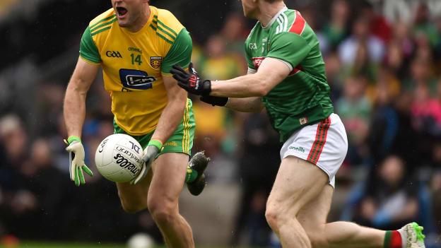 Michael Murphy, Donegal, and Colm Boyle, Mayo, during the 2019 All Ireland SFC Quarter-Final Group Phase encounter at Elverys MacHale Park.