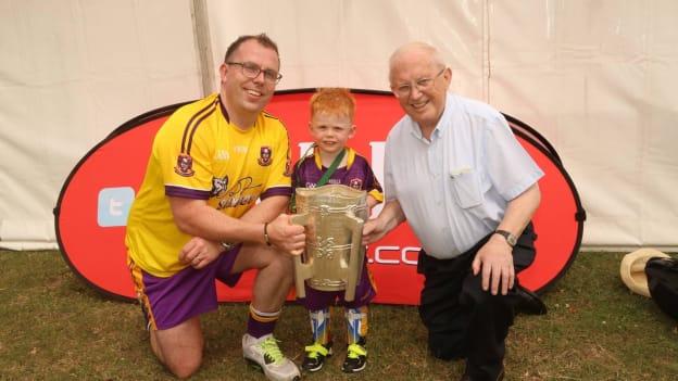 Martin Harrell with his son Oisín and late father, Tommy, who provided huge service to the GAA in London.