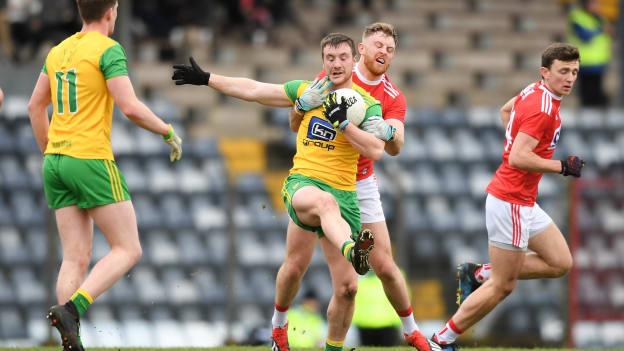 Leo McLoone of Donegal is tackled by Killian O'Hanlon of Cork during the Allianz Football League Division 2 Round 6 match between Cork and Donegal at Páirc Uí Rinn in Cork. 