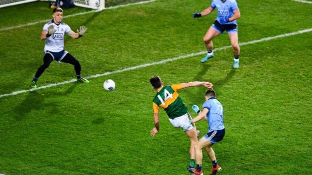 David Clifford of Kerry, 14, shoots past Dublin's Eoin Murchan, 7 and goalkeeper Evan Comerford to score a goal in the 18th minute of the 2020 Allianz Football League Division 1 Round 1 match between Dublin and Kerry at Croke Park in Dublin.