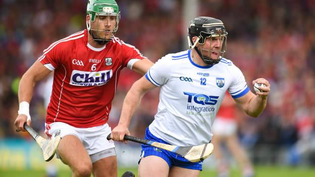 Jake Dillon, Waterford, and Eoin Cadogan, Cork, in Munster Senior Hurling Championship action at Semple Stadium.
